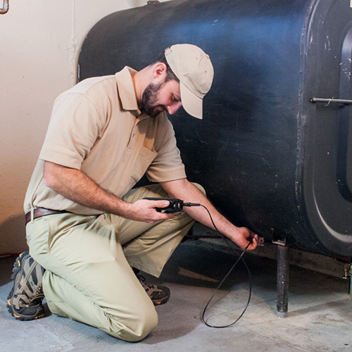 Technician Performing Oil Tank Testing by Estes Oil Company in Southern NH and Maine